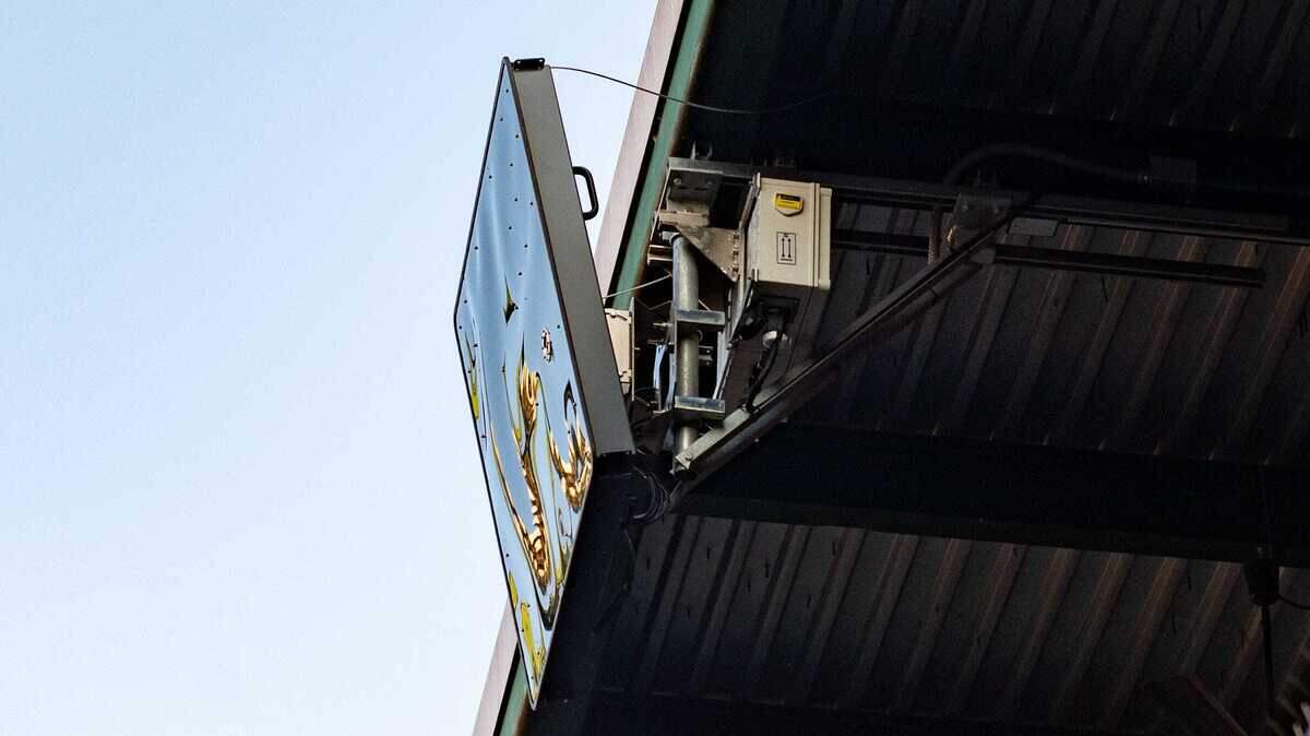 A radar device that transmits ball and strike calls to an umpire is seen during an Atlantic League game in 2019. Robot umpires, as the devices are known, are coming to Triple-A for the 2022 baseball season.