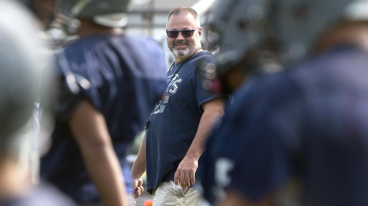 River Ridge head coach Steve Schultz looks over his players on the opening day of football practice at River Ridge High School in Lacey on Wednesday, Aug. 15, 2018.
