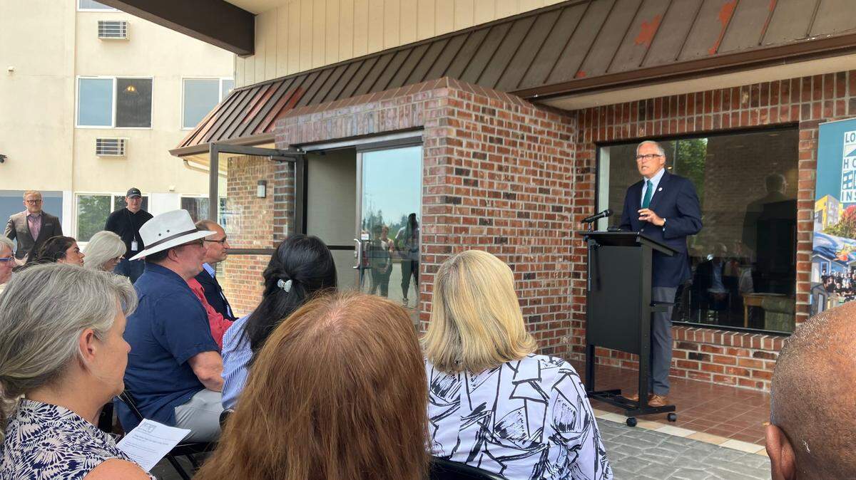 Gov. Jay Inslee on Wednesday addressed about 50 people, including several Thurston County, Olympia, Lacey and Tumwater officials, during the celebratory opening of Maple Court, a new homeless shelter in Lacey.