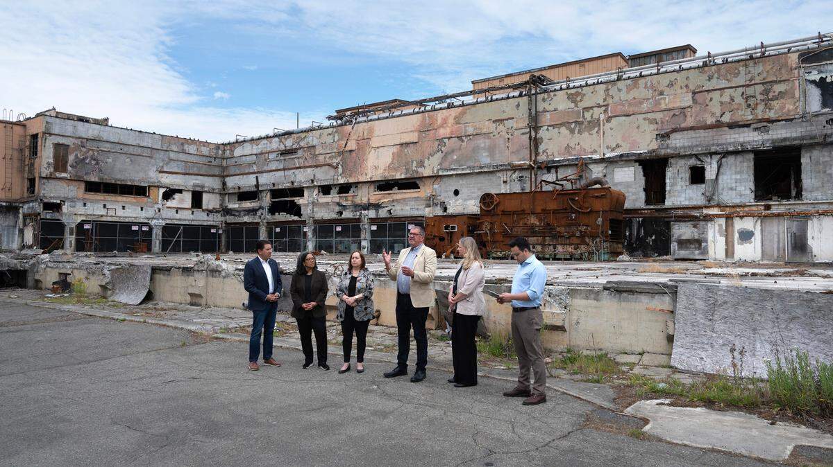 City, regional and national representatives gather at the former Olympia Brewery in Tumwater in 2023, for the announcement of a $500,000 grant to study the environmental effects of redeveloping the property. From left are EPA regional administrator Casey Sixkiller, U.S. Rep. Marilyn Strickland, Tumwater mayor Debbie Sullivan, former Tumwater city administrator John Dean, Tumwater city administrator Lisa Parks and Tumwater economic development manager Austin Ramirez.