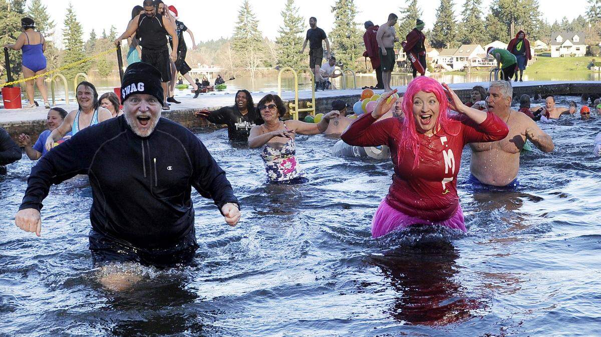 Around 480 hearty New Year’s Day revelers take their 2016 Polar Bear Plunge in the 38-degree water of Lacey’s Long Lake.