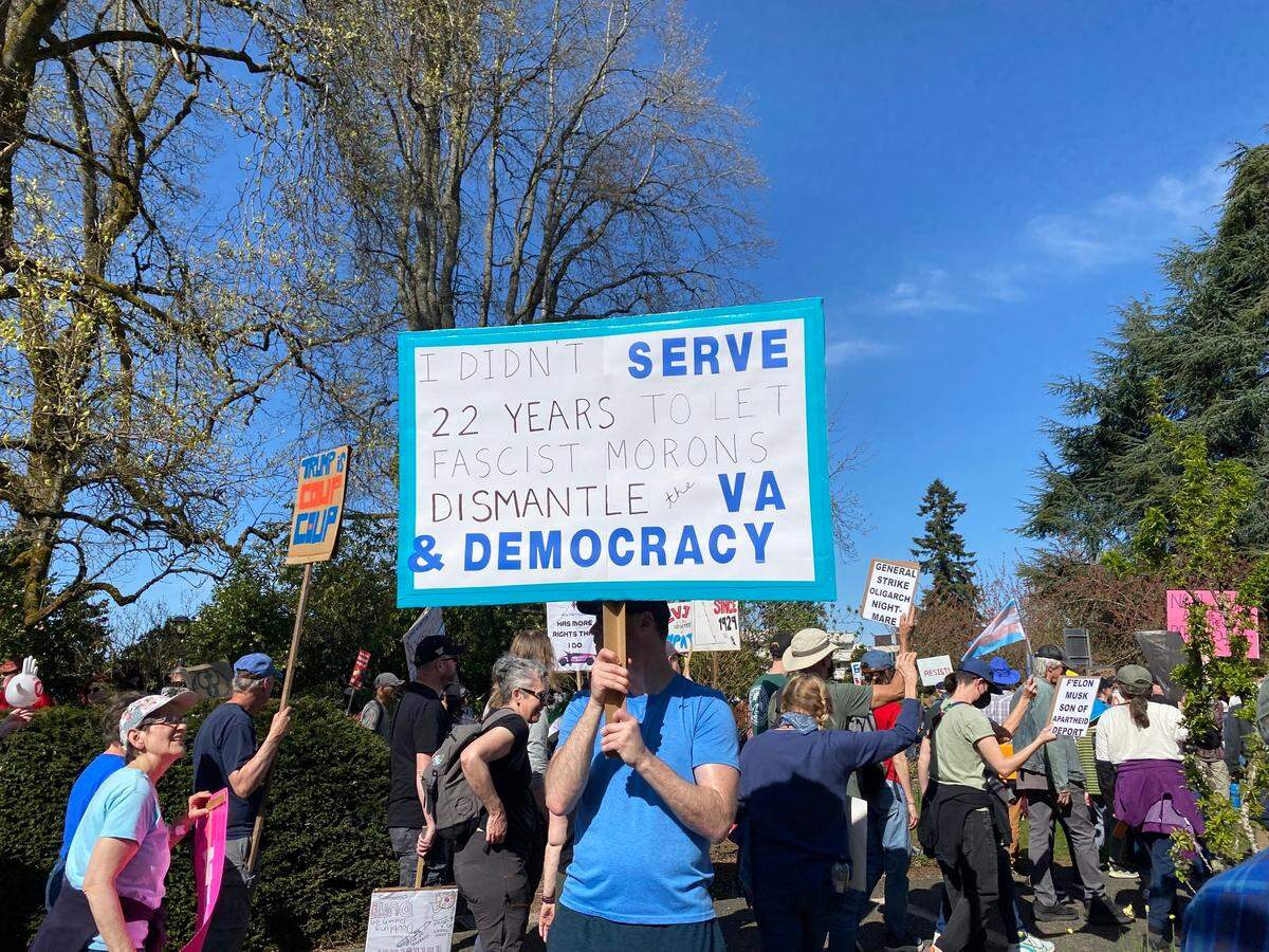 Veterans showed up with signs that said, “I’m a veteran, not a sucker or a loser” and “I didn’t serve 22 years to let fascist morons dismantle the VA and democracy.”