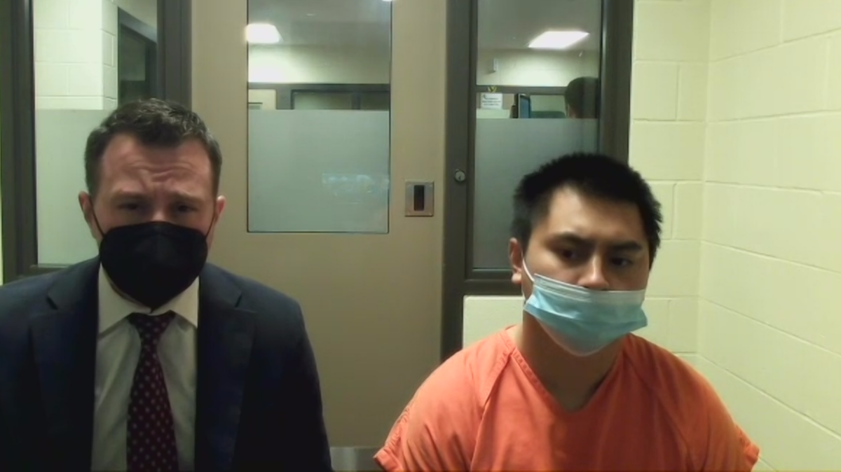 John Nguyen, 23, (right) sits next to public defense attorney Eric Pilon (left) at the Thurston County jail on Monday, Sept. 19. Nguyen attended his preliminary appearance in Thurston County Superior Court on second-degree murder charges connected with the fatal shooting of a Tumwater man outside a WinCo Foods grocery store on Saturday, Sept. 17.