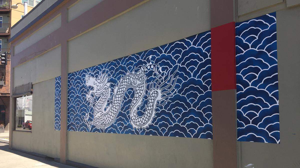 A mural honors Olympia’s Chinese-American history at the corner of Fifth Avenue Southwest and Columbia Street in downtown Olympia.