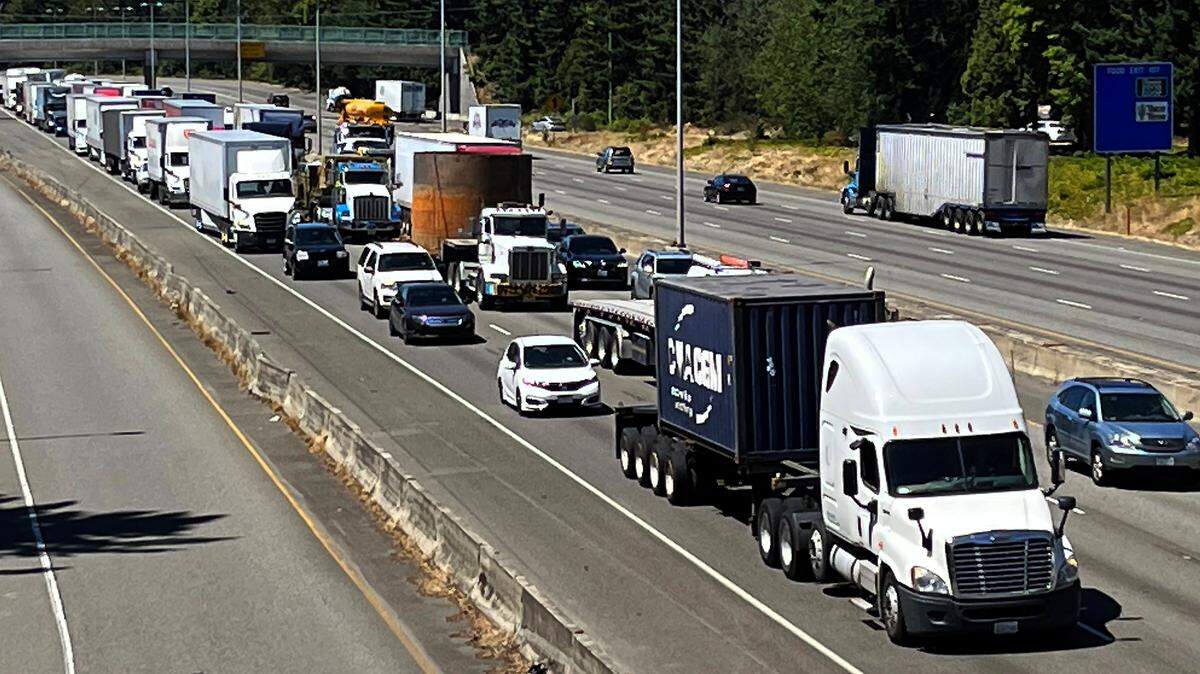 Northbound I-5 traffic through Lacey at a standstill Wednesday afternoon after a semi-truck vs. car crash earlier in the day.