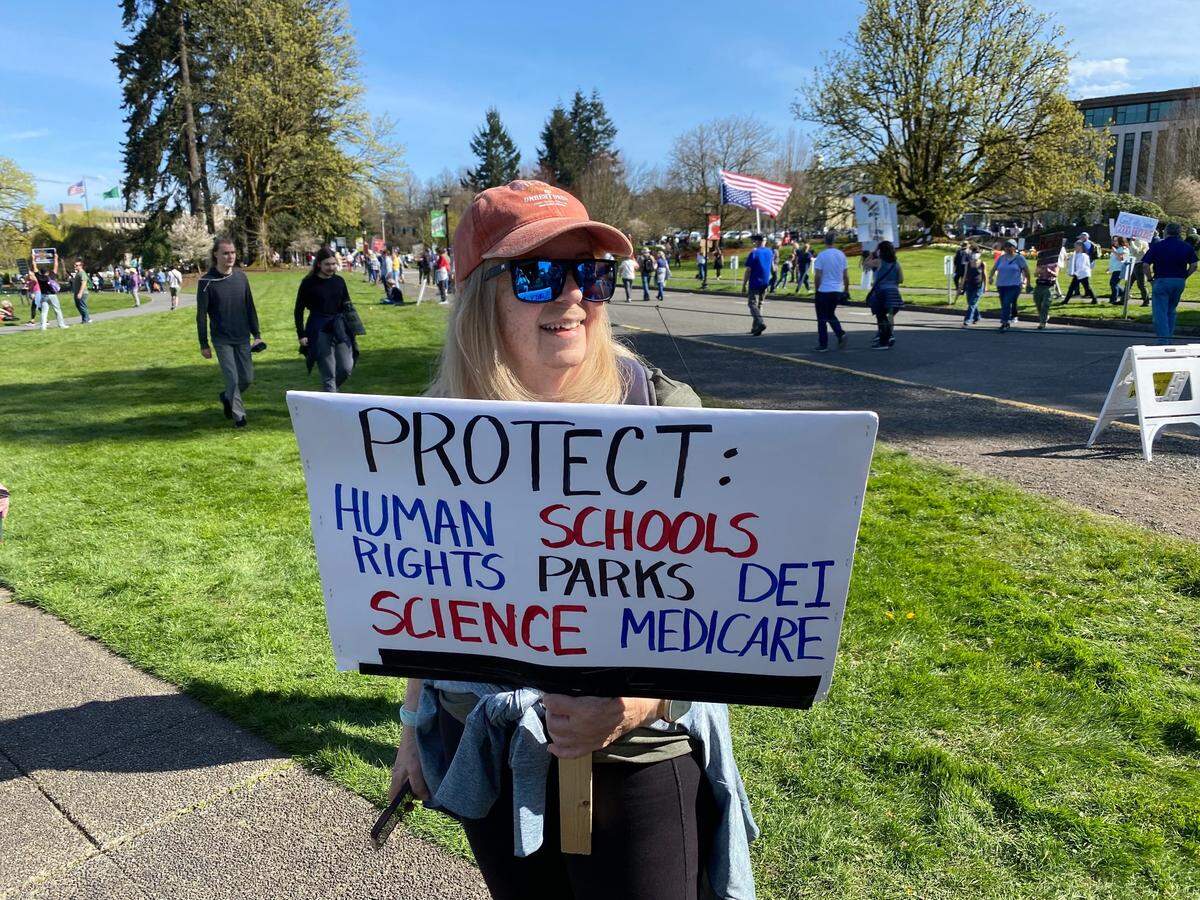Many different issues motivated people to attend Saturday’s Hands Off rally against the Trump Administration at the state Capitol Campus. When someone commented on how many items this woman had highlighted on her sign, she said simply, “It’s everything!”