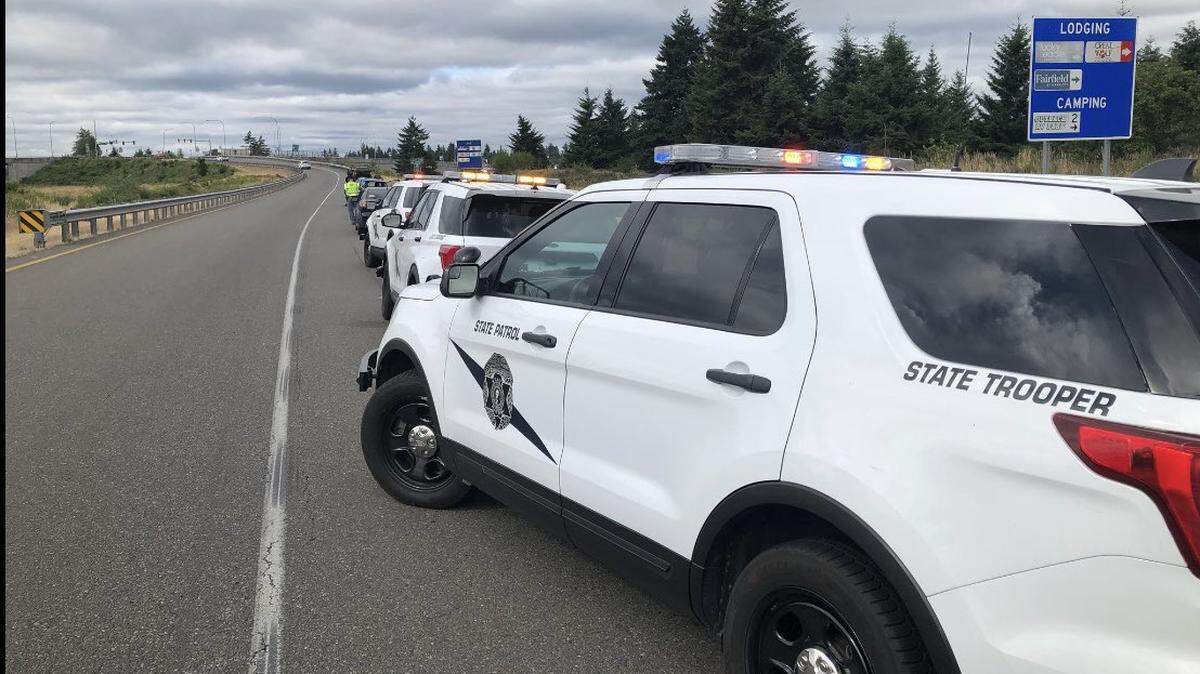 Washington State Patrol vehicles sit on the shoulder of I-5 exit 88 to investigate a crash that killed two people Thursday morning.