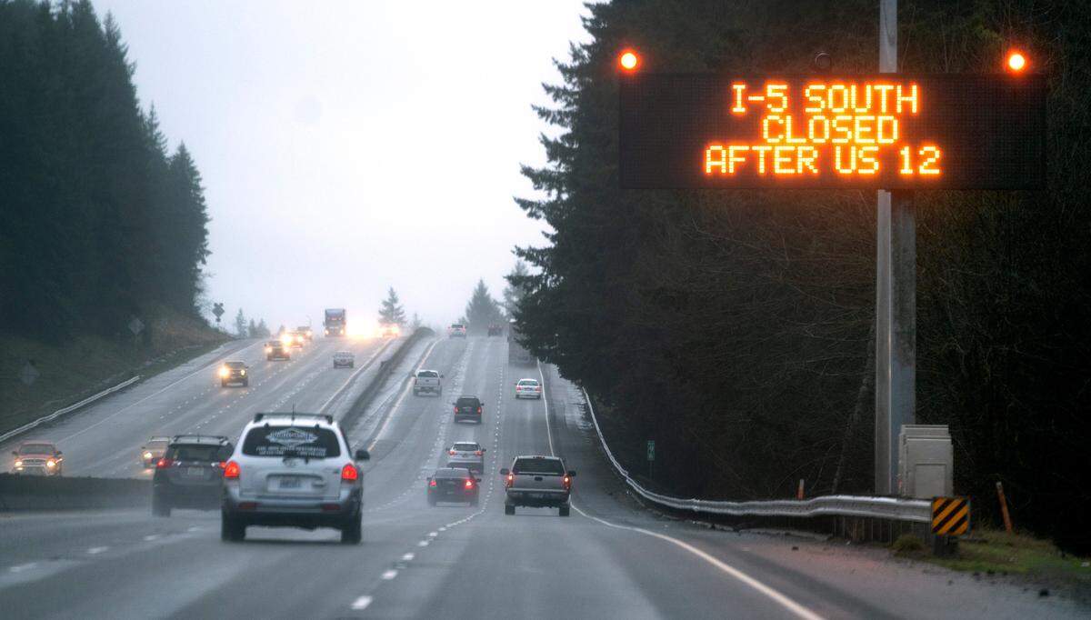A sign on Interstate 5 mear Maytown, Washington, notifies that the freeway is fully closed because of rising floodwaters over the roadway in Chehalis, Washington, on Friday, Jan. 7, 2022.