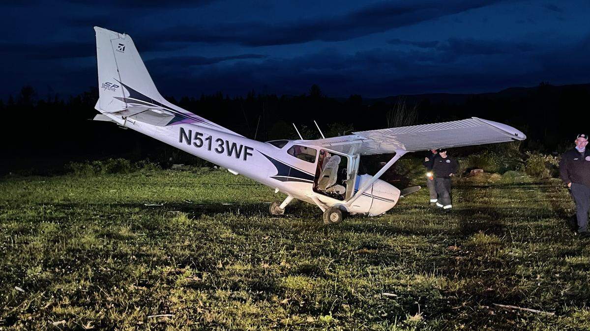 A small propeller plane rests in a pasture outside Yelm after an emergency landing on Thursday, June 10. Captain Brian Richardson with the Southeast Thurston Fire Authority said the couple suffered no injuries and were released following the incident.