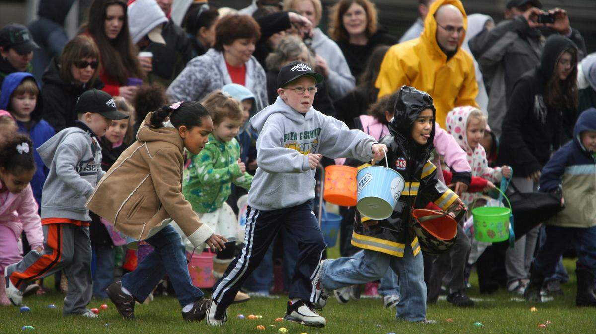 Tumwater children take off at the start of the 2010 Easter Egg Hunt at Tumwater High School.