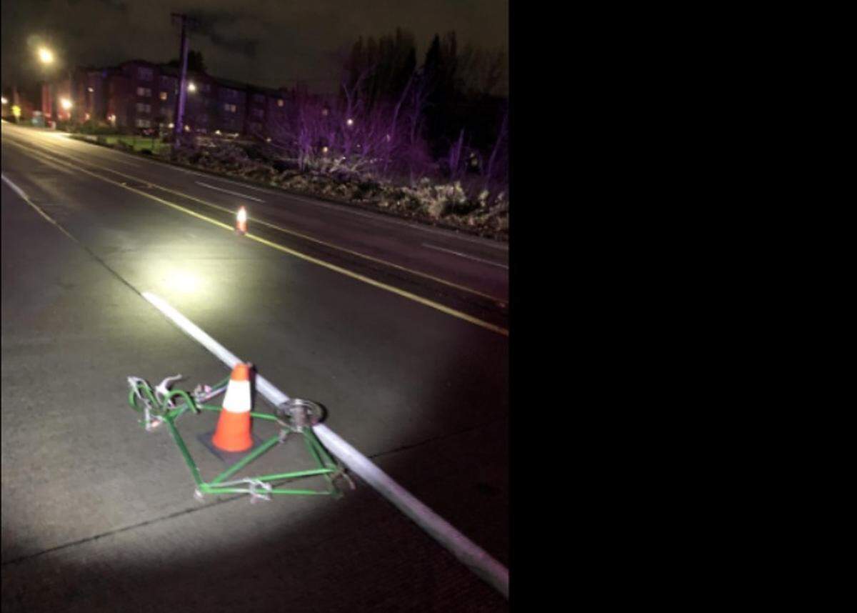 A bicycle is seen lying in the middle of Martin Way East in Olympia after a hit-and-run collision about 3 a.m. Saturday, Dec. 6. The man riding the bike later died at an area hospital.