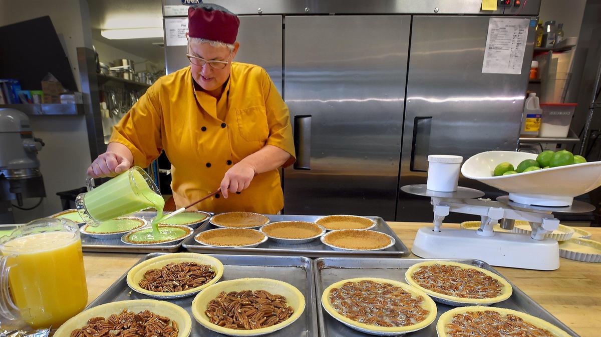 Phoebe Martinson of Phoebe’s Pastry Cafe and staff prepare a plethora of Thanksgiving pies Monday. The cafe sold out orders of its pre-made Thanksgiving dinners this year. "A lot of people just don't want to cook," Martinson says.
