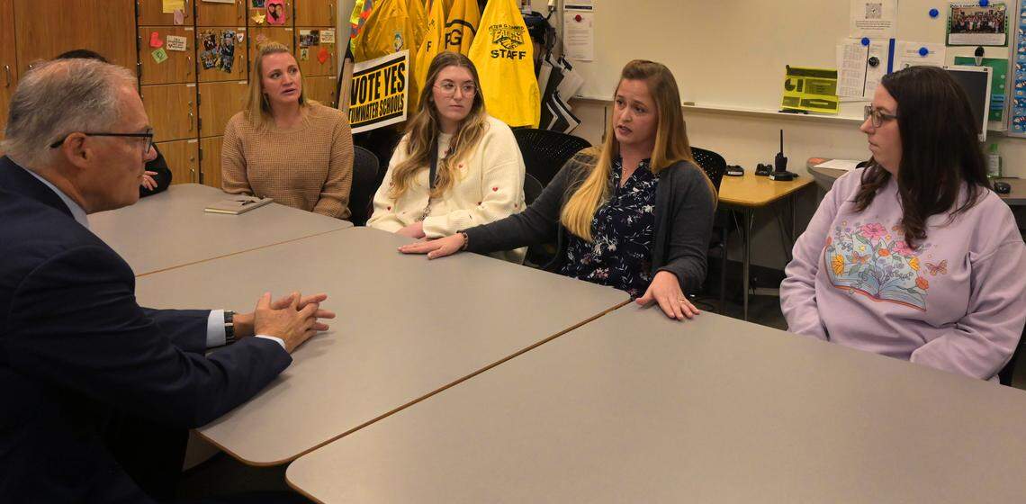 Gov. Jay Inslee visited this week with some paraeducators at Peter G. Schmidt Elementary School in Tumwater. From left are Jaime Dominoski, Evahleigh Hedin-Baughn, Kristin Sperling and Marie Butcher.