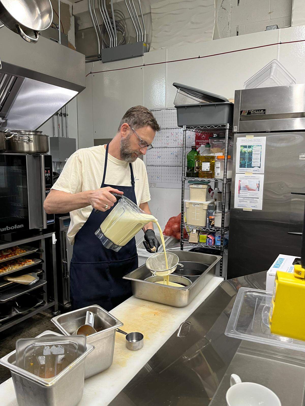 Working their usually packed weekday lunch hour on Thursday July 10 Rich Root along with his wife Kirsten Herrera-Root are co-owners of Mi Luna Cuban Cafe. Herrera-Root, who grew up in Olympia, moved back to the capital a couple years ago with her family and opened the restaurant in early April, 2025.