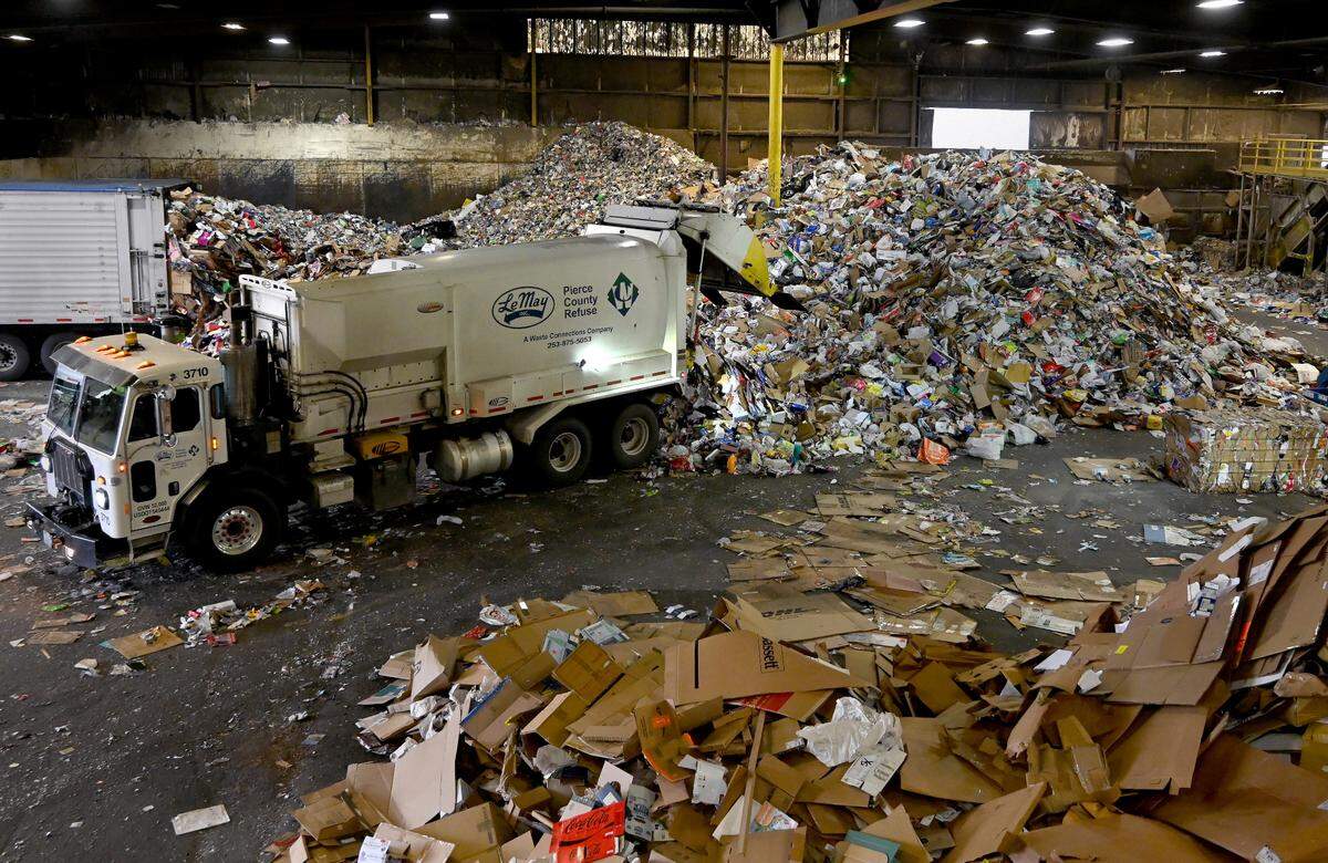 Waste Connection’s Government Affairs Manager Rick Vail leads a Jan. 17 tour of the Pioneer Recycling Services’ Material Recovery Facility (MRF) near Tacoma, Wa.