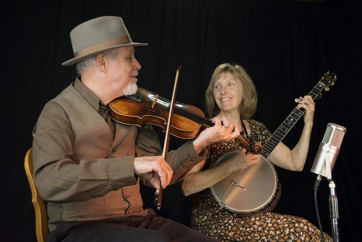 From left, Joe McHugh on fiddle and Paula McHugh on banjo.