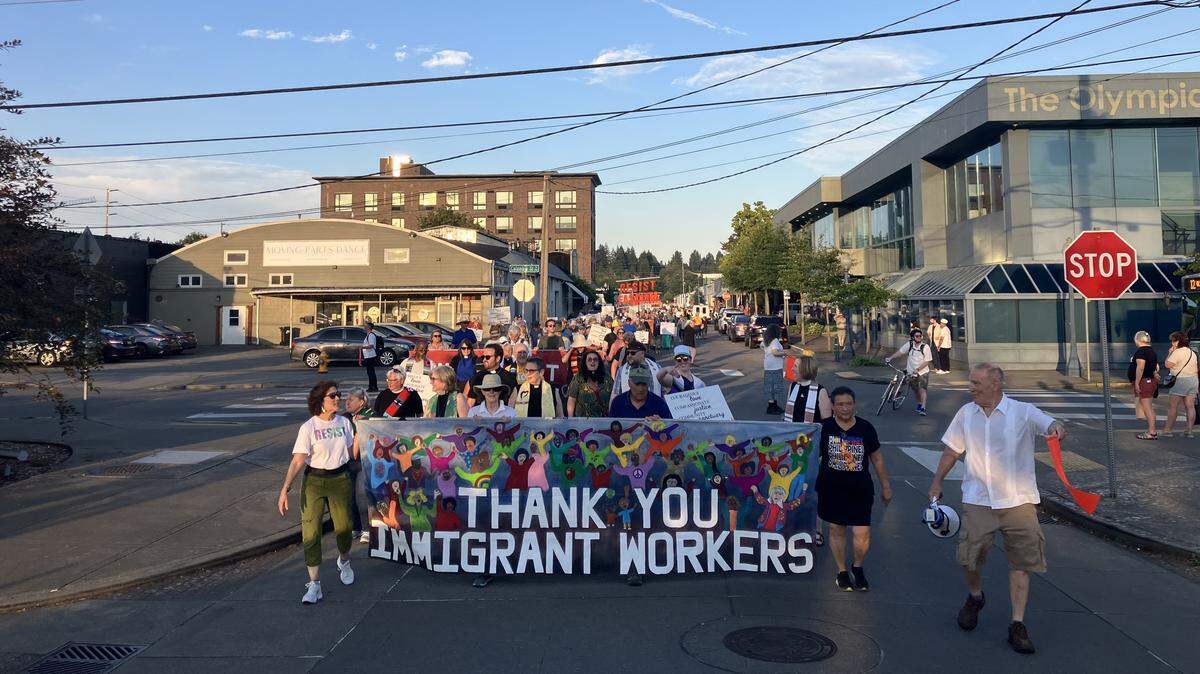 Hundreds of people marched through downtown Olympia early Saturday evening in support of immigrant rights and justice.