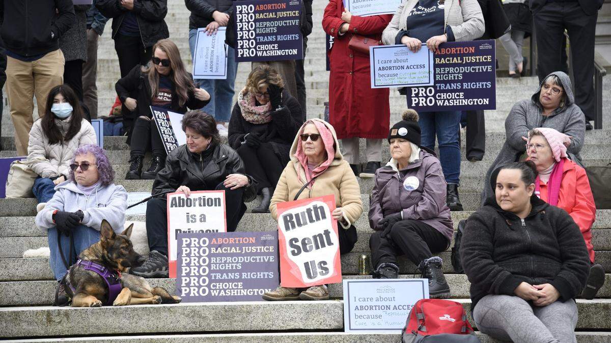 Abortion rights activists rally outside Washington’s Legislative Building in Olympia on Tuesday as Senate committees heard testimony on a package of bills aimed at protecting reproductive rights.
