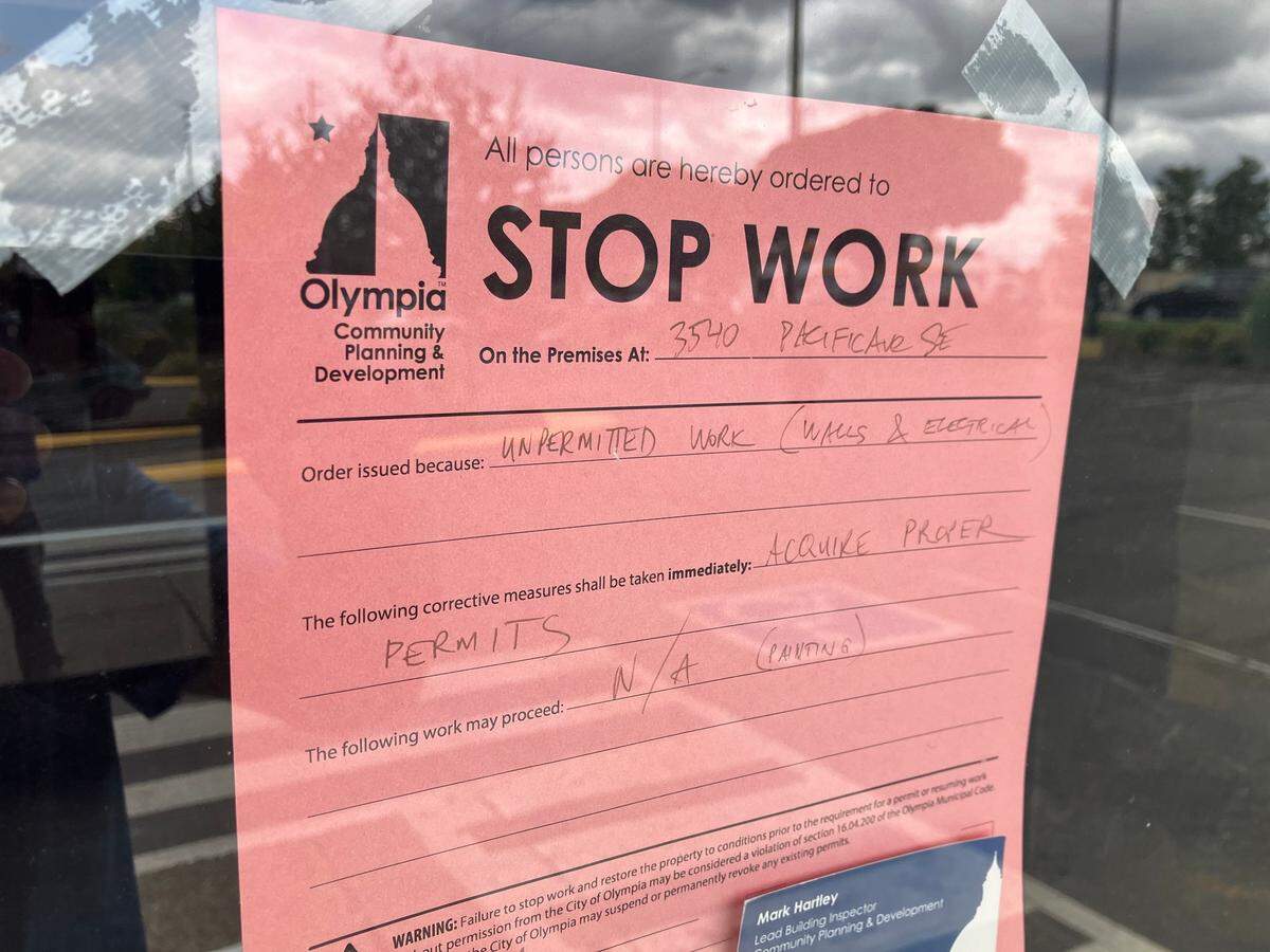 The city of Olympia stop work order attached to the front door at Yummy Crab.