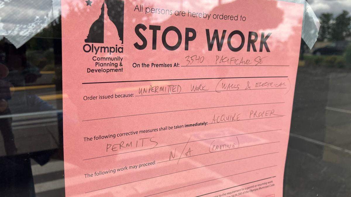 The city of Olympia stop work order attached to the front door at Yummy Crab.