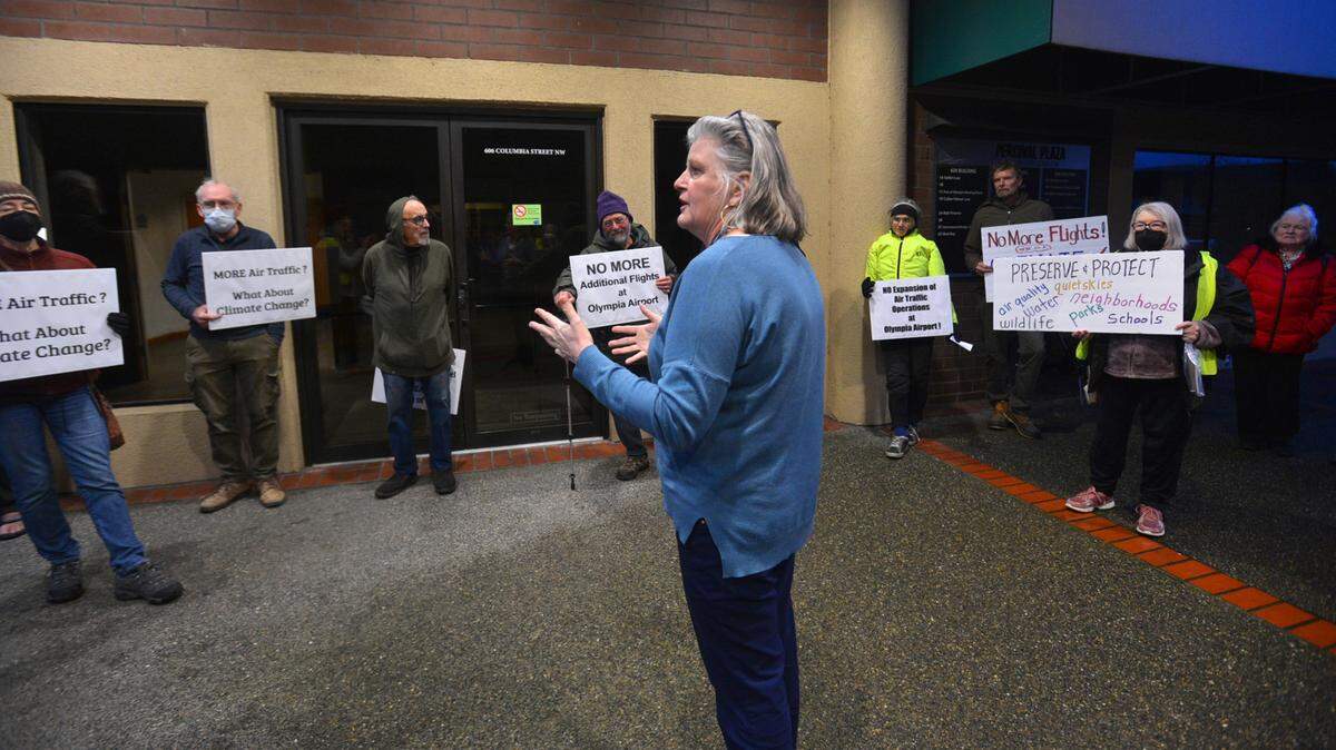 Port of Olympia Executive Director Sam Gibboney welcomes a group of around 60 gathered before a January 2023 meeting of the Port of Olympia Commissioners at Percival Plaza to protest operational changes they fear would drastically impact air traffic at the Olympia Regional Airport.
