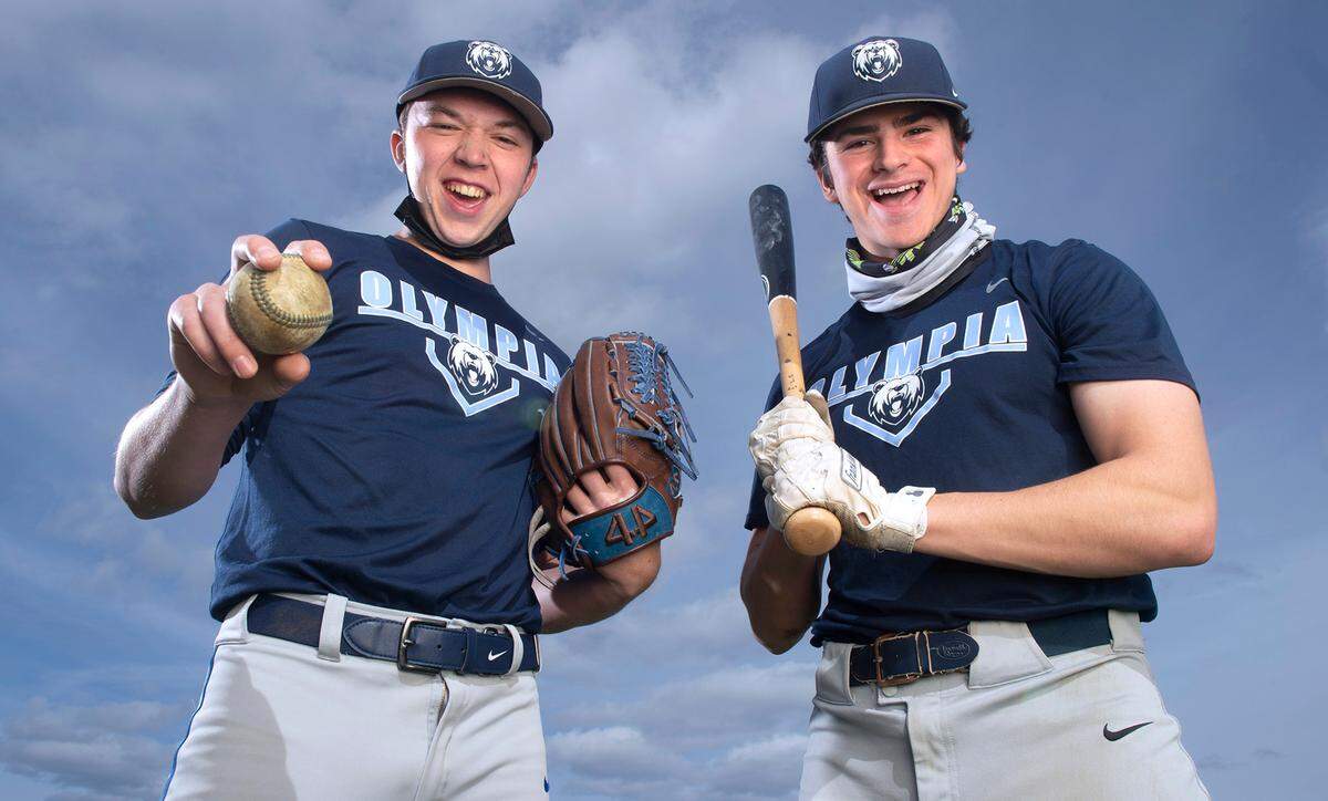 Olympia junior pitcher/outfielder Rylan Haider (left) and senior pitcher/infielder Aiden Herrick are expected to lead the Bears as they contend for a 4A SPSL title. They are shown before baseball practice at Olympia High School on Friday, April 2, 2021.