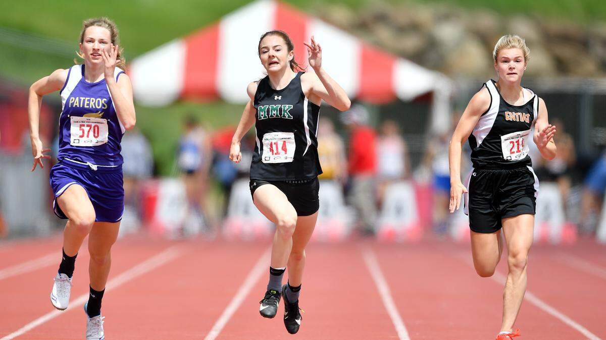 Mary M. Knight’s Kaylee Sowle, center, battles 1B Girls 100m Dash during the WIAA 1B Washington State Track and Field Championships on Saturday, May 25, 2019, in Cheney, Wash.