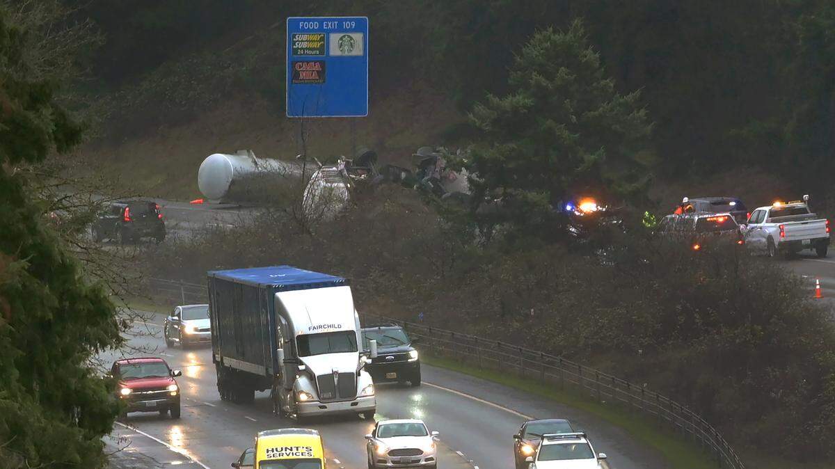 A semi-truck carrying fuel rolled over on southbound Interstate 5 near Carpenter Road in Lacey during rush hour Monday morning, March 13, 2023. The Department of Ecology was called to the scene for the cleanup.