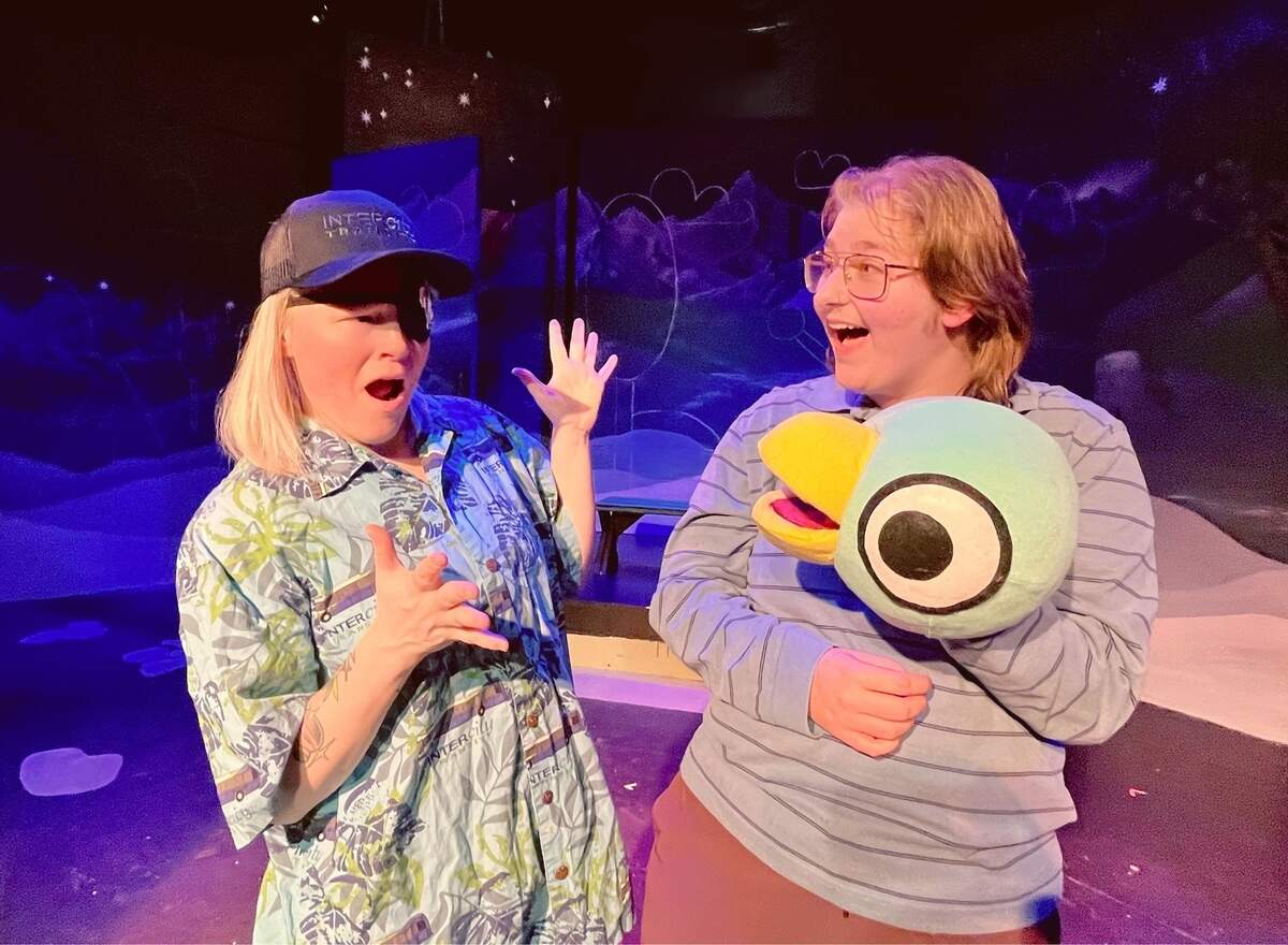 The Bus Driver (Rachel Martin), wearing an Intercity Transit cap and shirt, faces off with the Pigeon (Marcel Beardslee) in Olympia Family Theater’s “Don’t Let the Pigeon Drive the Bus.”