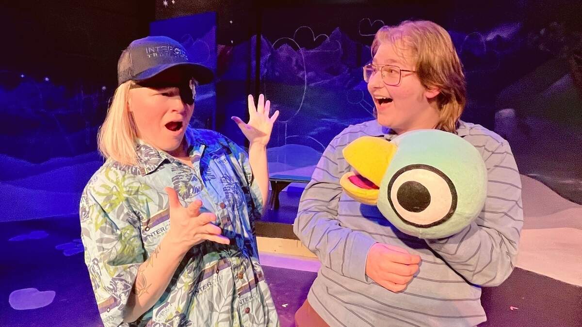 The Bus Driver (Rachel Martin), wearing an Intercity Transit cap and shirt, faces off with the Pigeon (Marcel Beardslee) in Olympia Family Theater’s “Don’t Let the Pigeon Drive the Bus.”