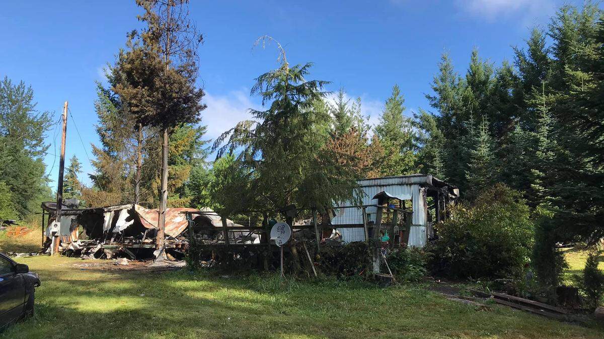 Fire destroyed a mobile home on Tipsoo Loop North in Rainier early Saturday. One of the residents was found dead inside.