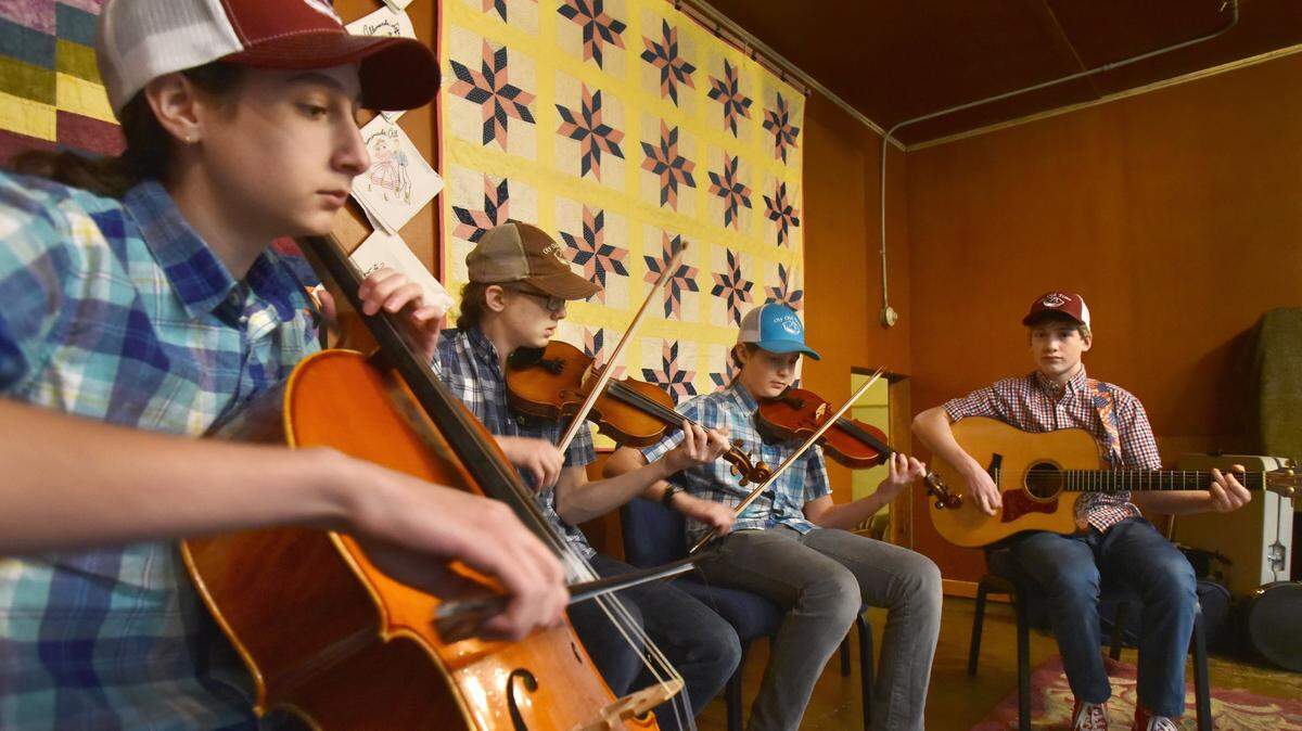 The REDS perform at the Thursday night kick-off dance at the 9th annual Oly Old Time Music Festival. From left, Dante Faulk, River Schuerell, and brothers Eros Faulk and Sage Scheuerell.