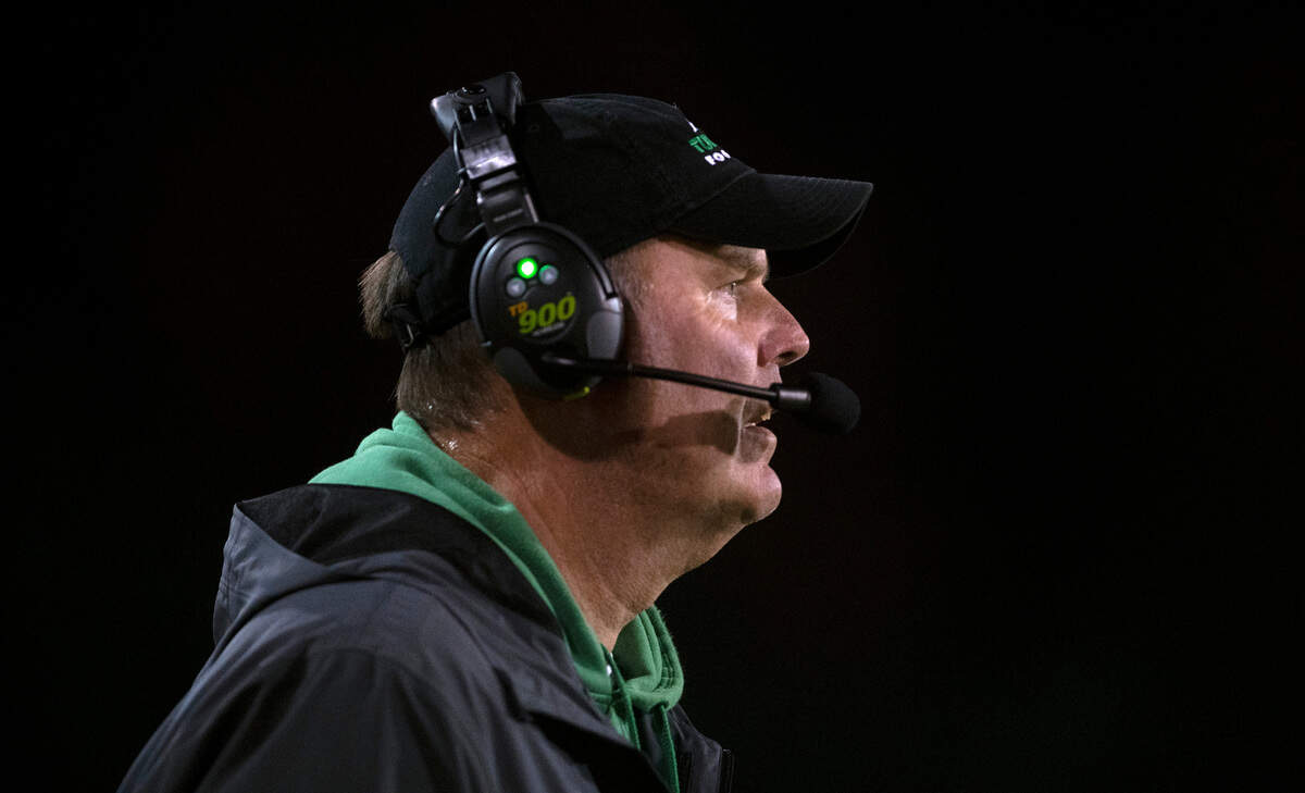 Tumwater head football coach Bill Beattie watches the T-Birds from the sidelines during Friday night’s high school football game against the Camas Papermakers at Tumwater District Stadium in Tumwater, Washington, on Oct. 15, 2021.