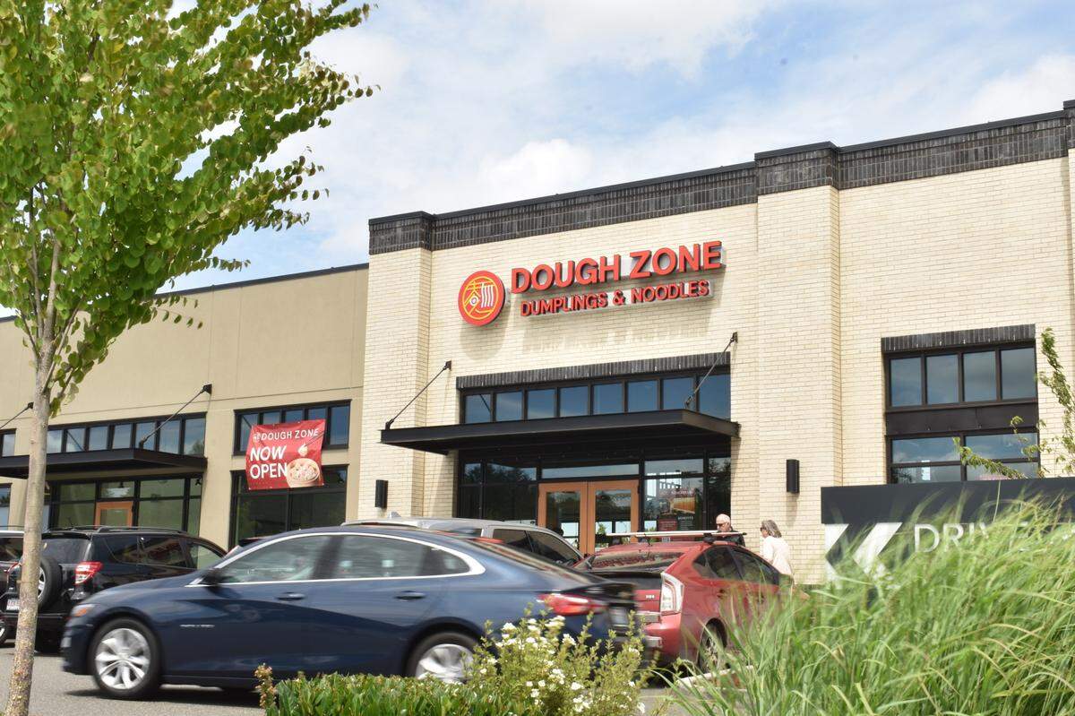A car drives past Dough Zone in Lacey, Washington.