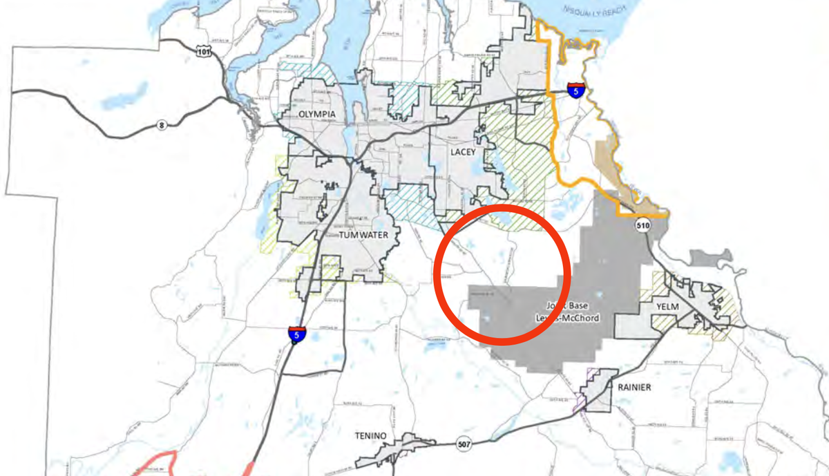 A map of Thurston County that includes a circular area where a proposed international airport may be situated. Warren Hendrickson, acting chair of Commercial Aviation Coordinating Commission, shared this map with the Orting City Council on Dec. 14, 2022. It shows the proposed site area overlapping with land controlled by Joint Base Lewis-McCord.