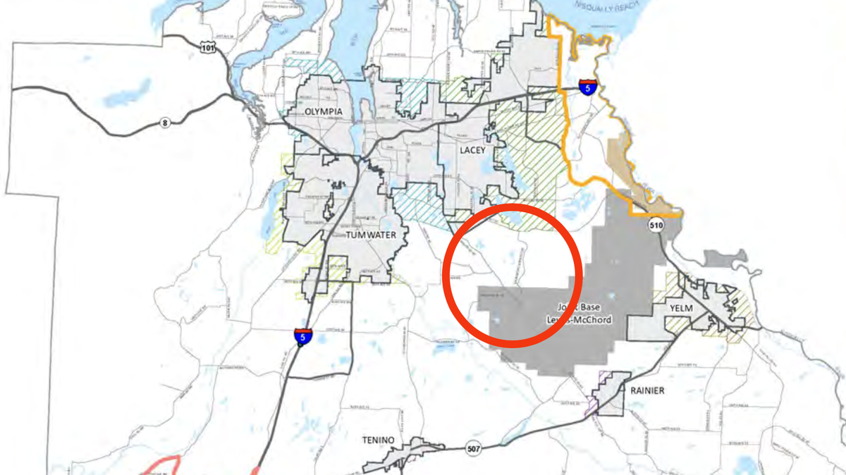 A map of Thurston County that includes a circular area where a proposed international airport may be situated. Warren Hendrickson, acting chair of Commercial Aviation Coordinating Commission, shared this map with the Orting City Council on Dec. 14, 2022. It shows the proposed site area overlapping with land controlled by Joint Base Lewis-McCord.