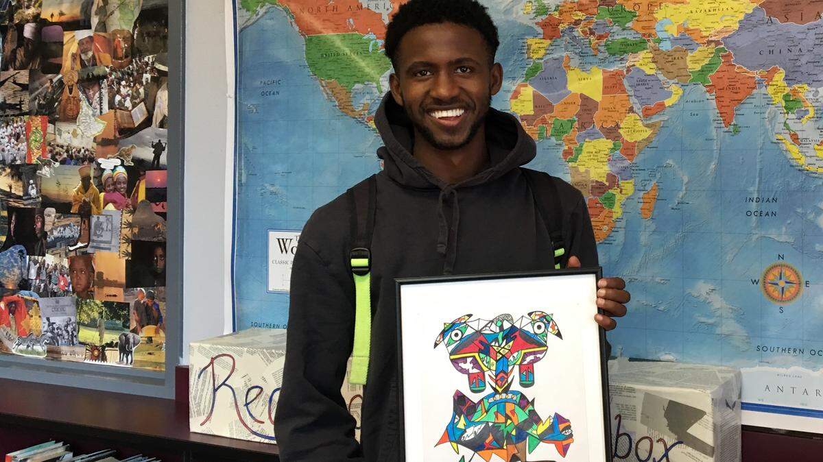 Black Hills High School graduate Yitagesu Dowty with one of his drawings.