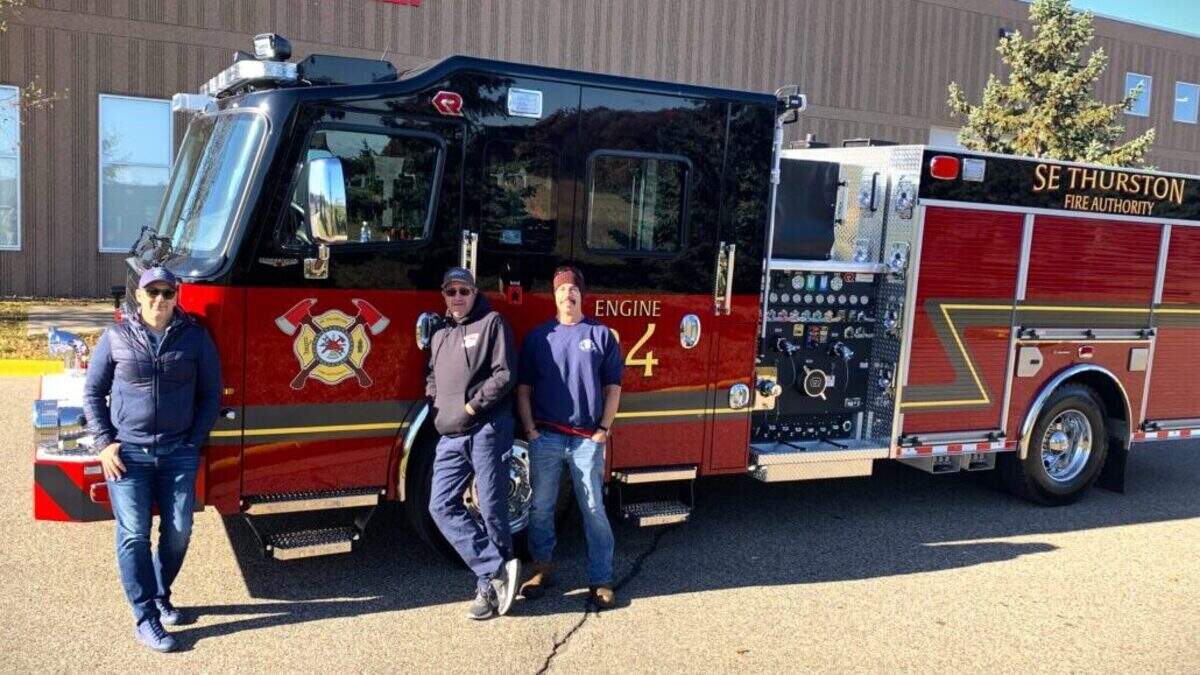 From left, Deputy Chief Kevin Denton, Captain Eric Hetand and firefighter Tony Brosco, all from the Southeast Thurston Fire Authority. The fire authority bought a new pumper truck this week with help from the Washington State Treasurer’s Office.