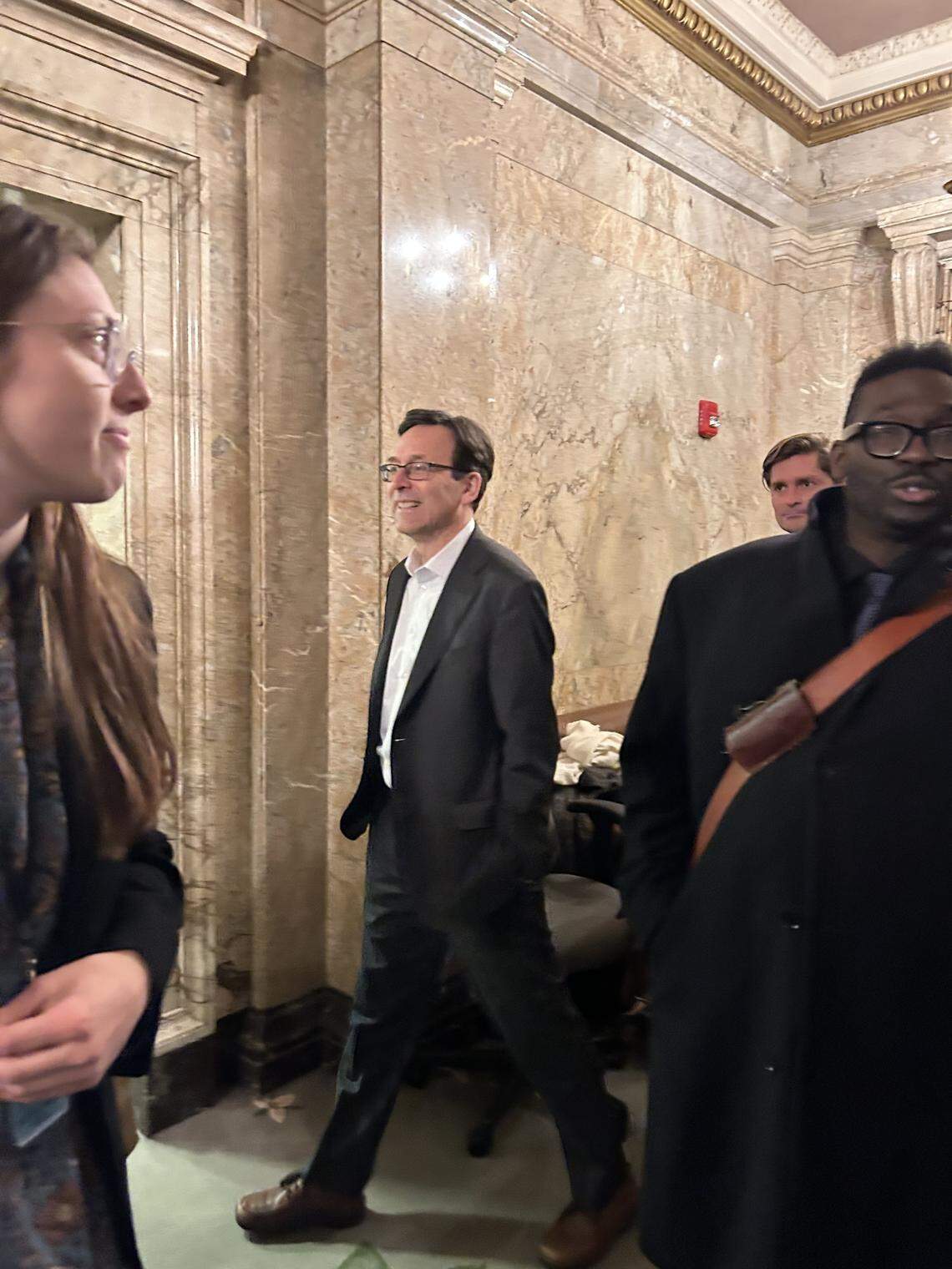 Gov. Bob Ferguson enters the House chambers on March 10, minutes before Democrats passed the so-called millionaires tax.