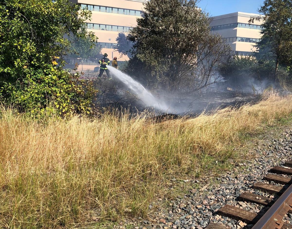 Olympia Fire Department responded to a brush fire along railroad tracks near Plum Street Tuesday.
