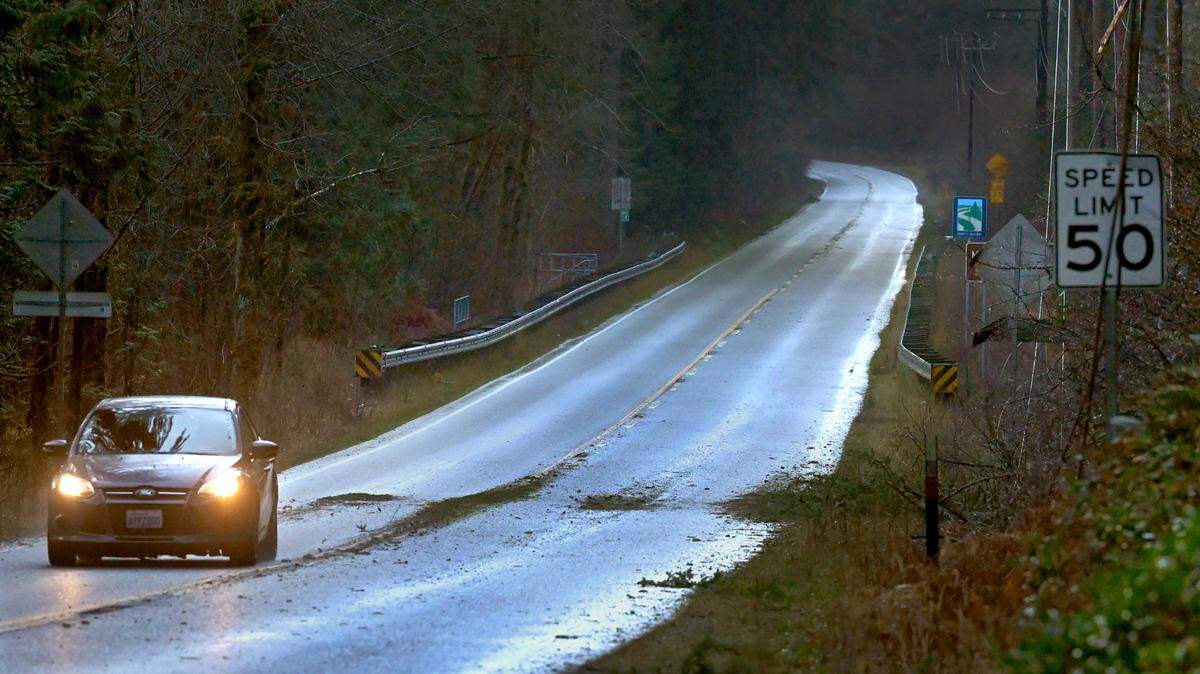 Downed power lines await repair near the intersection of Tilley and McCorkle roads in Thurston County early Wednesday morning after high winds and heavy rain overnight left many without electricity.