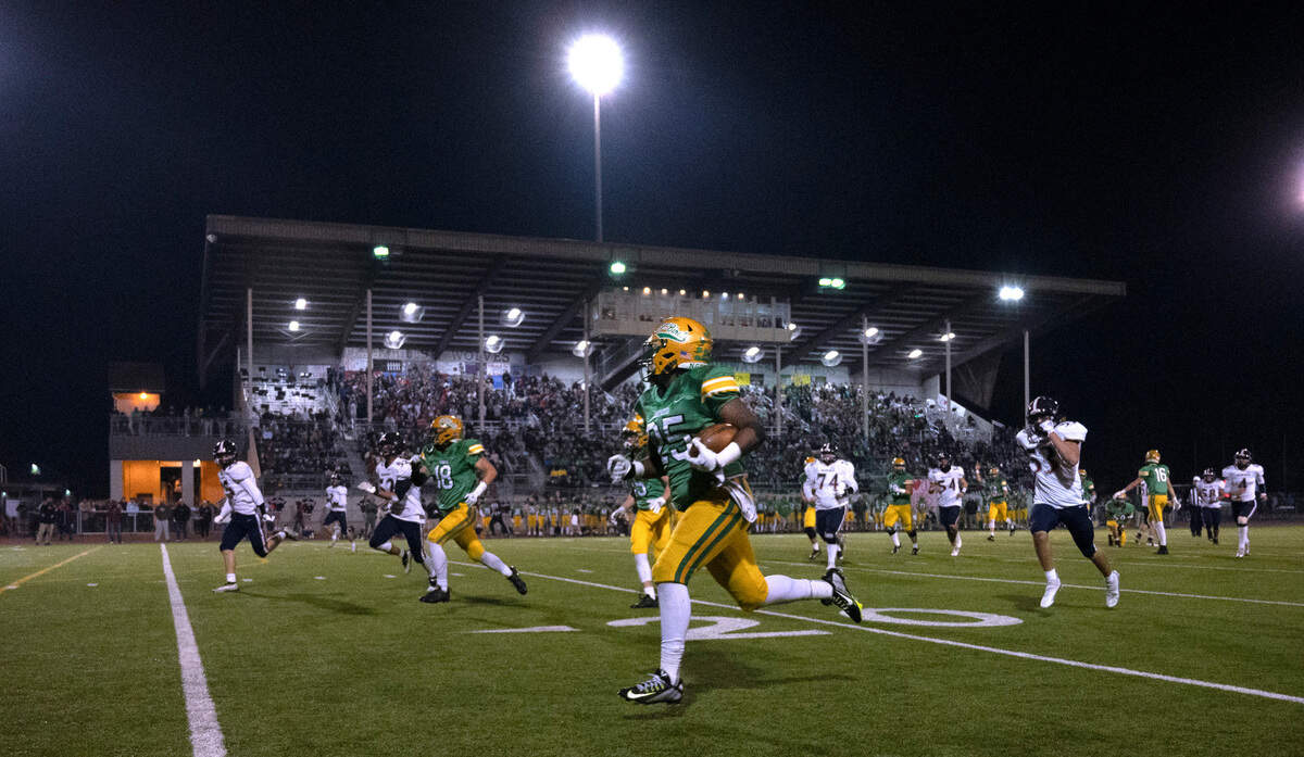 Tumwater running back Carlos Matheney breaks loose against the Black Hills defense for one of his four touchdowns during Friday night’s Pioneer Bowl crosstown rivalry football game at Tumwater District Stadium in Tumwater, Washington, on Oct. 28, 2022.
