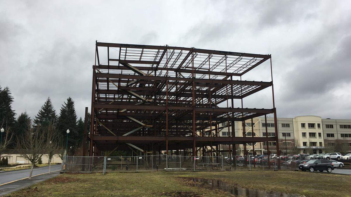 A proposed office building in Tumwater that was stymied by the Great Recession, and then sat unfinished as a steel skeleton for at least a decade, is finally coming down, according to city of Tumwater and Port of Olympia officials.