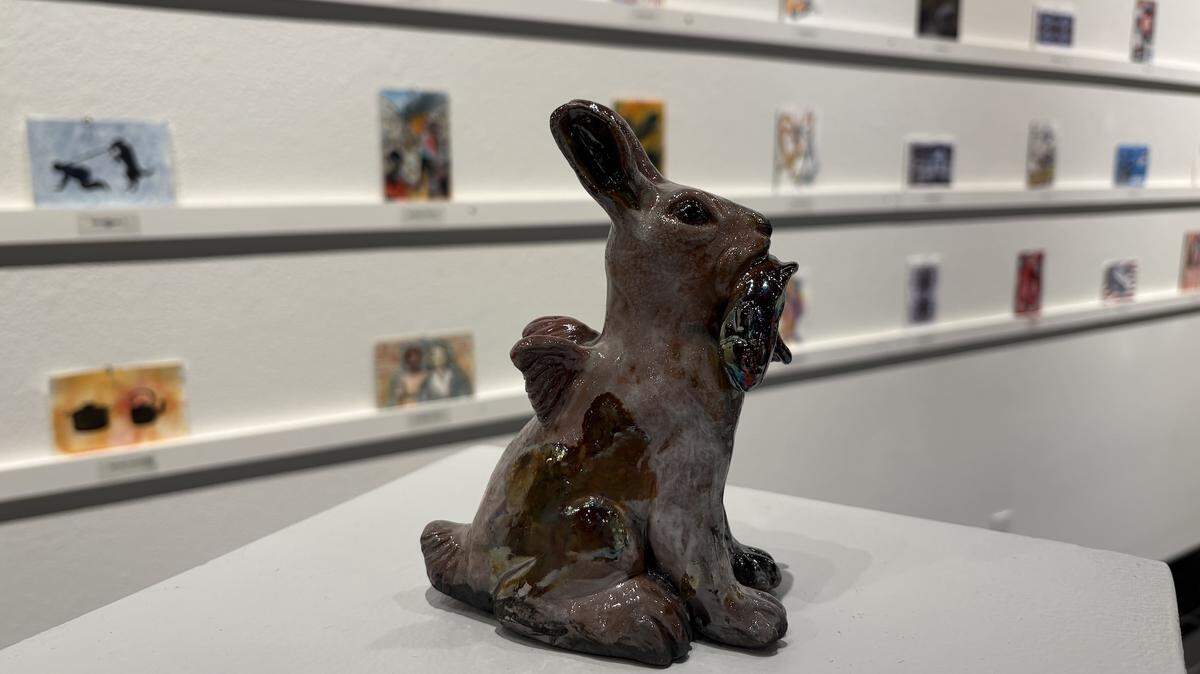 A winged rabbit by ceramic artist Joe Batt, a professor of art at South Puget Sound Community College, is one of the whimsical works on view in the college’s 2026 Fine Art Postcard Exhibition.