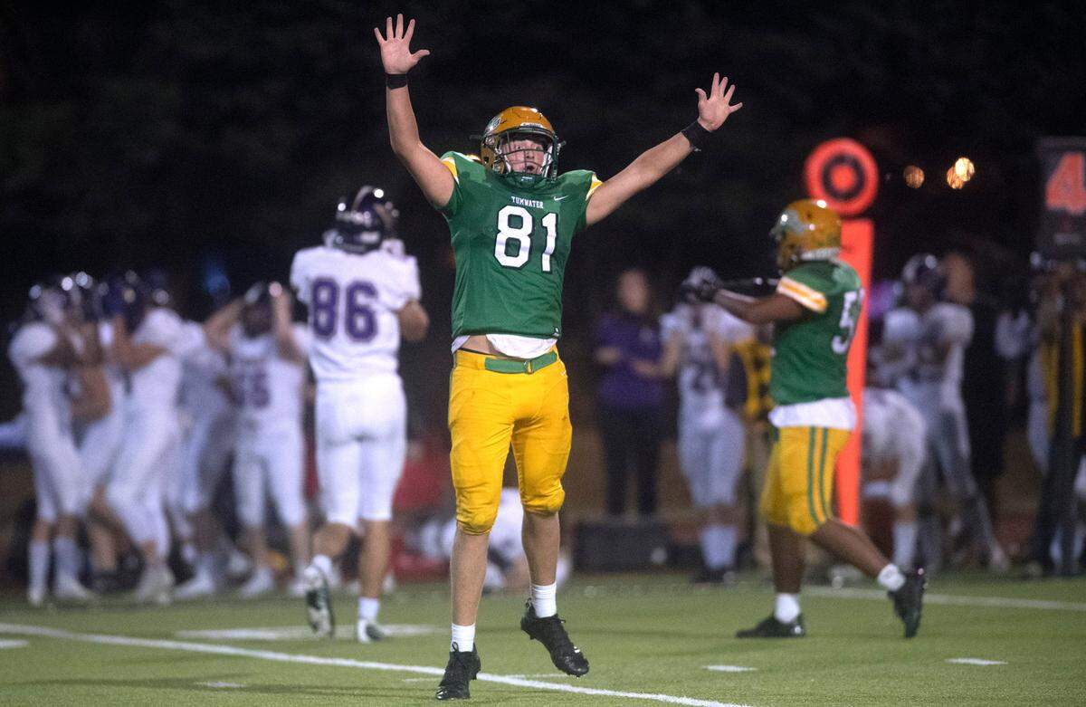 Tumwater linebacker Beckett Wall celebrates a fourth-down stop of the North Kitsap Vikings during Friday night’s 2A football game at Tumwater District Stadium in Tumwater, Washington, on Sept. 9, 2022. Tumwater won the game, 8-6.