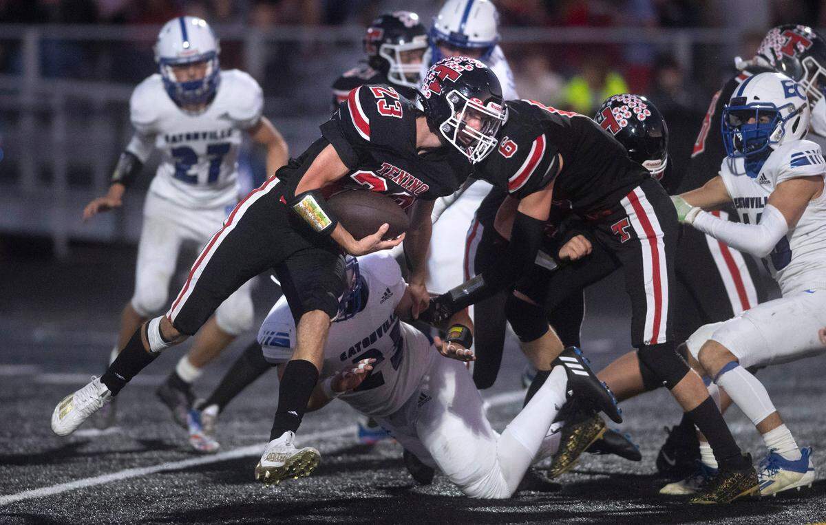 Tenino running back Dylan Spicer tries to slip past Eatonville defensive lineman Evan Wimbles during Friday night’s 2A football game at Tenino Beaver Stadium in Tenino, Washington, on Sept. 30, 2022.