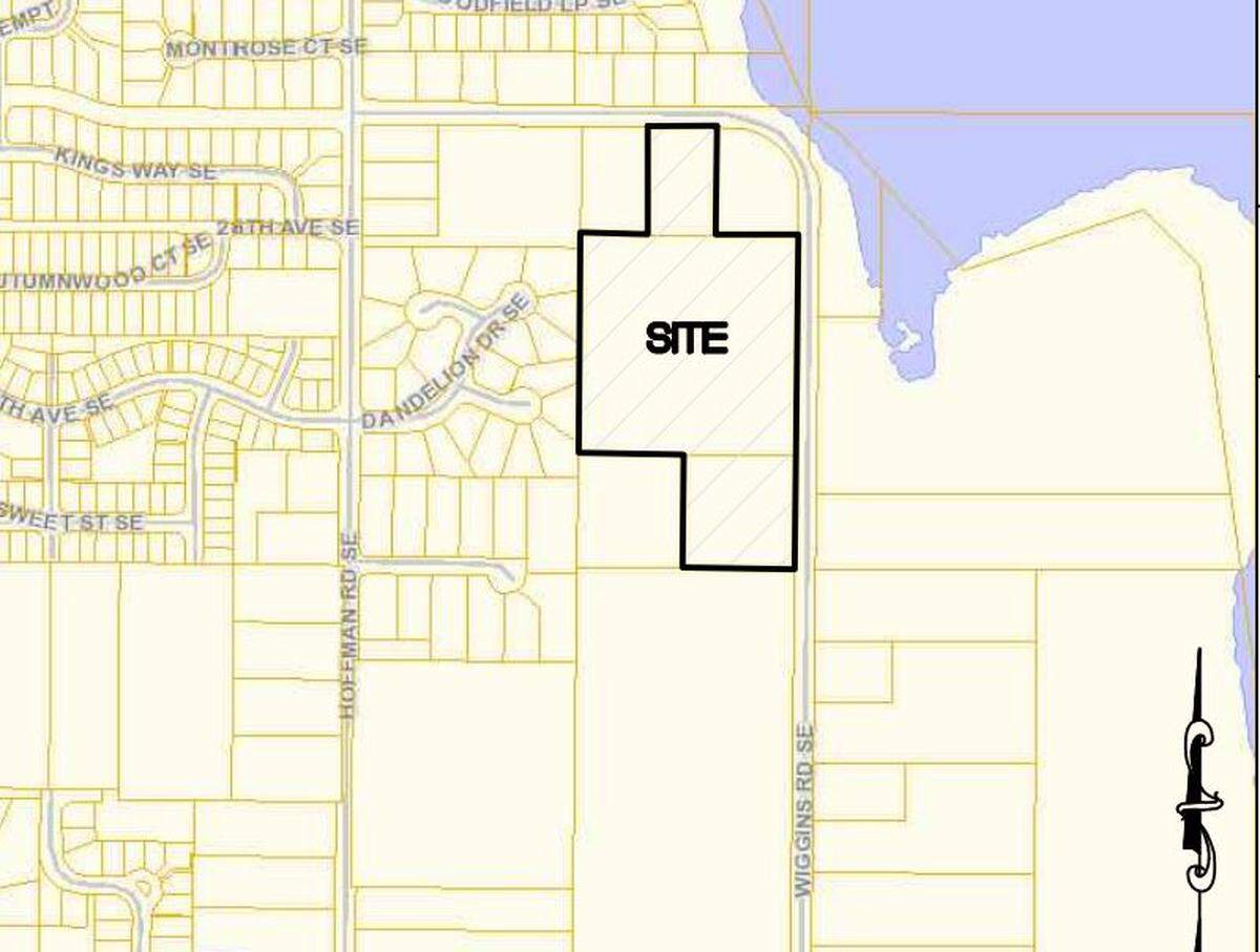 The site of a new housing proposal on Wiggins Road in Olympia. The nearby body of water is Chambers Lake.