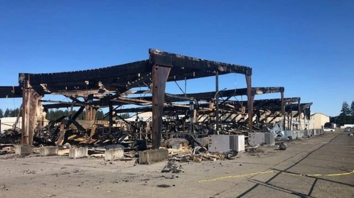 A Port of Shelton building operated by M&R Distributing is in ruins after a Tuesday night blaze. The building housed Rogue Raven Farms, a cannabis producer. Mason County Fire District 11 and several other neighboring fire districts contained the fire to the 35,000-square-foot building and extinguished it within two and half hours.