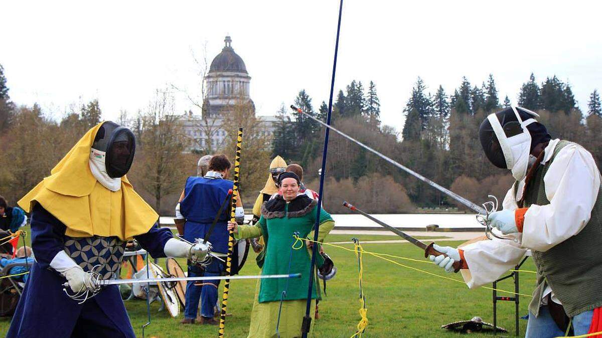 Kat Knudson officiates while fighters poise themselves for combat at last year’s Shamrock Tourney in Olympia.