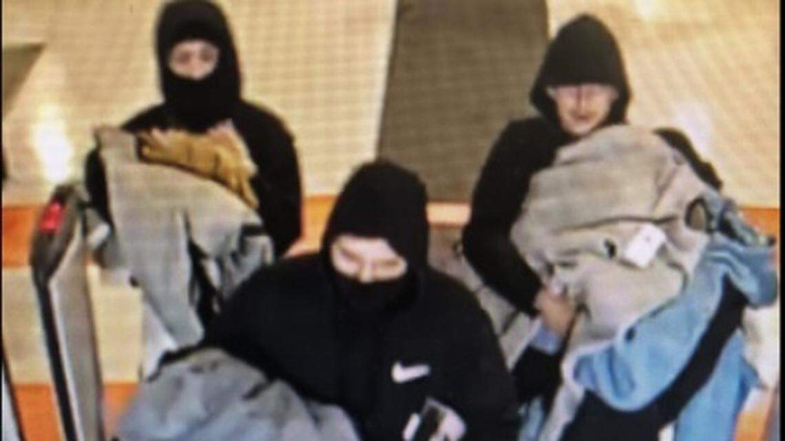 Three of the four suspects are shown leaving Dick’s Sporting Goods last week with stolen merchandise.